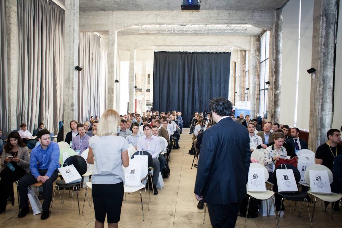 Instructor addressing a large professional audience